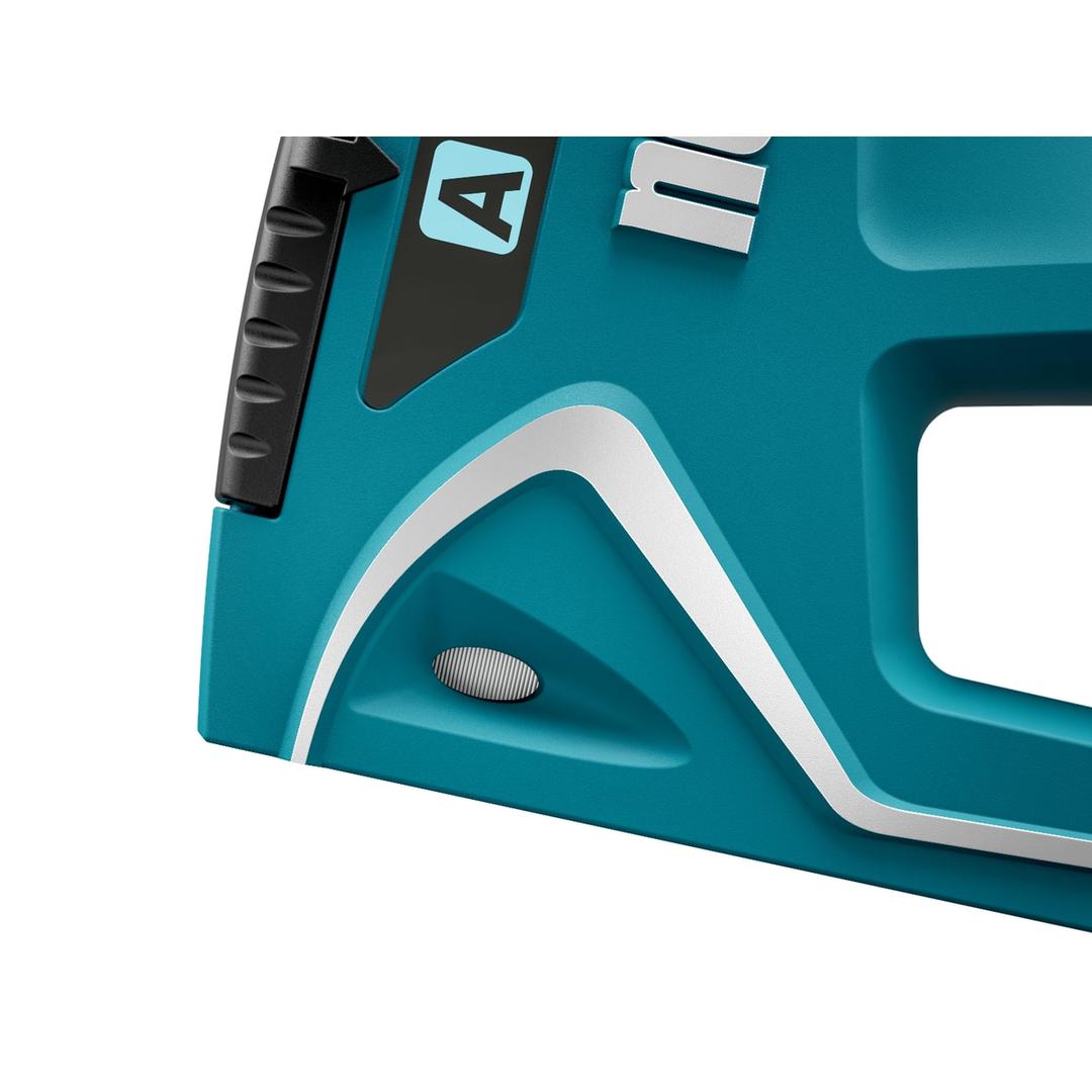 Agrafeuse manuelle J-15 NOVUS — NOVUS agrafeuse manuelle J-15 — macro du corps turquoise, liseré blanc et pastille striée du carter